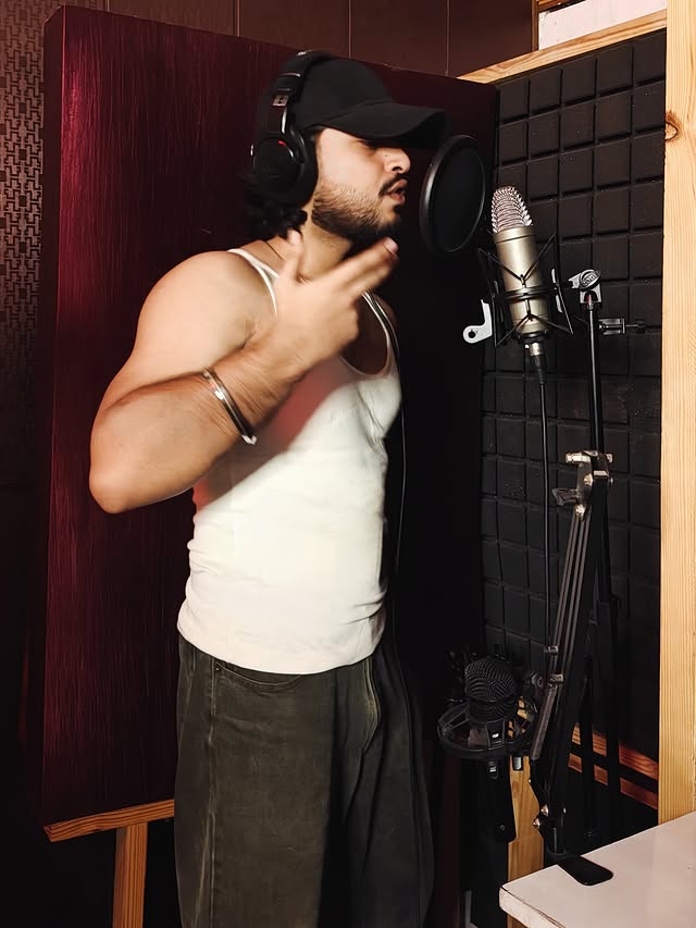 Samarth recording vocals in a studio